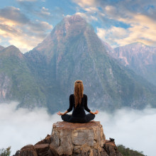 meditating on a mountain