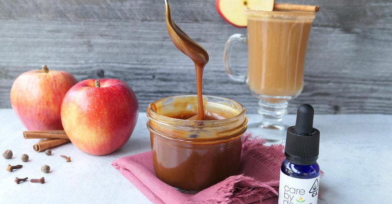 Photo of the ingredients to make Caramel Apple CBD Cider, including apples, clove, and carmel