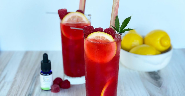 Photo of Raspberry Rhubarb Palmer cocktail with raspberry gummy garnish