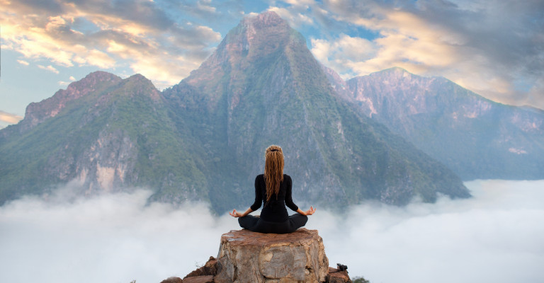 meditating on a mountain