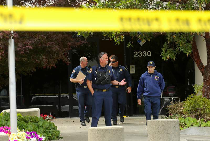 Photo of policemen standing out in front of CannaCraft Headquarters