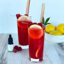 Photo of Raspberry Rhubarb Palmer cocktail with raspberry gummy garnish