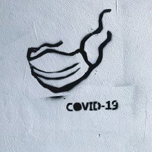 Photo of graffiti of person wearing Covid 19 mask